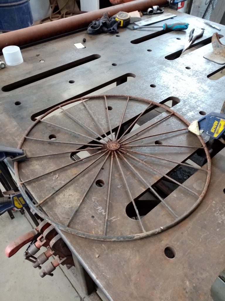 Preparing the wheel to be cleaned with wire brush.